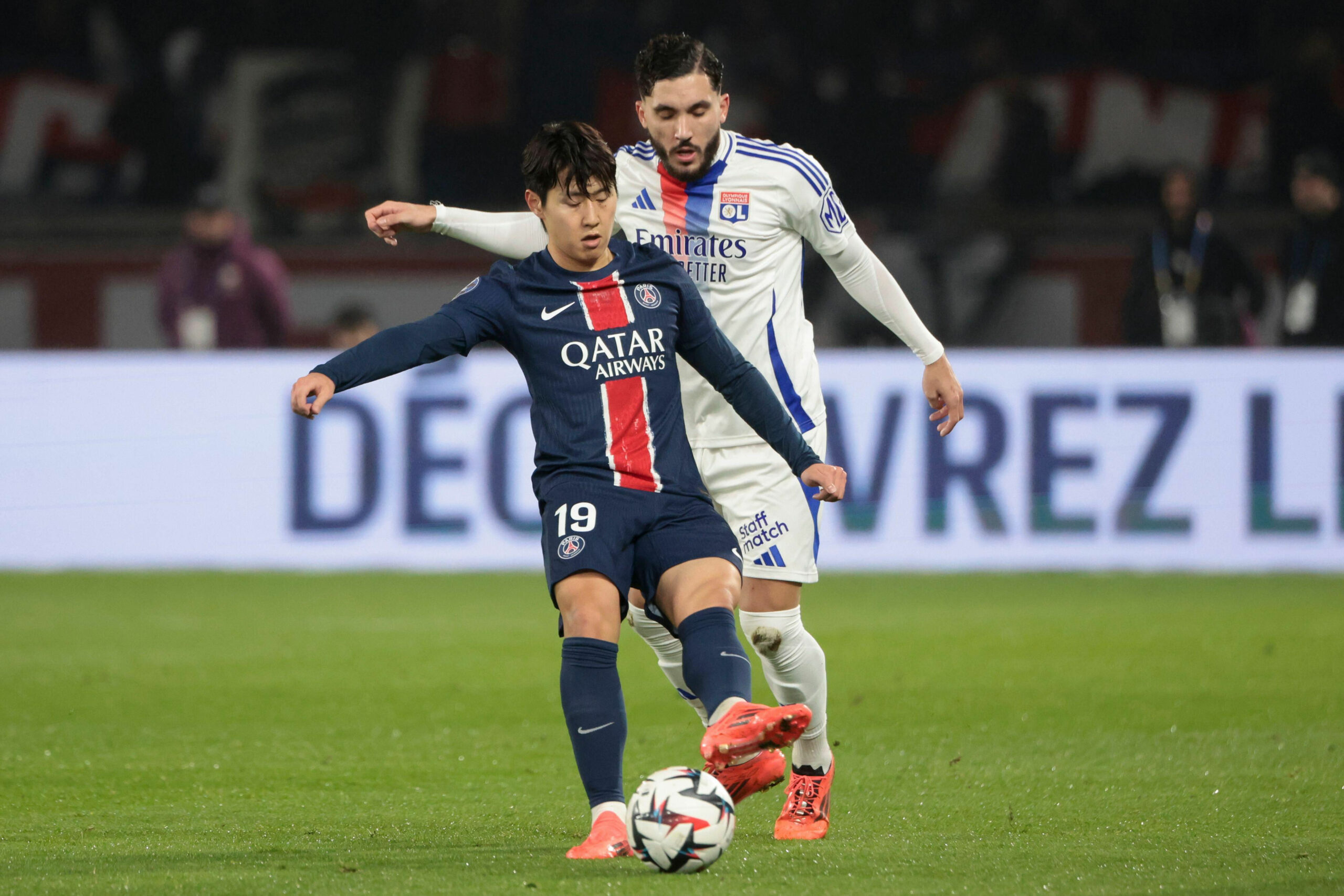 Paris, France. 15th Dec, 2024. Lee Kang-in of PSG, Rayan Cherki of Lyon during the French championship Ligue 1 football match between Paris Saint-Germain (PSG) and Olympique Lyonnais (OL, Lyon) on 15 December 2024 at Parc des Princes stadium in Paris, France - Photo Jean Catuffe/DPPI Credit: DPPI Media/Alamy Live News