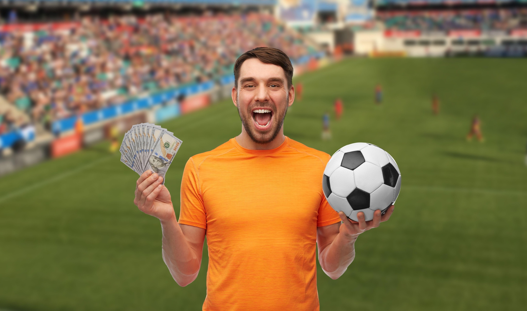 happy football fan with soccer ball and money