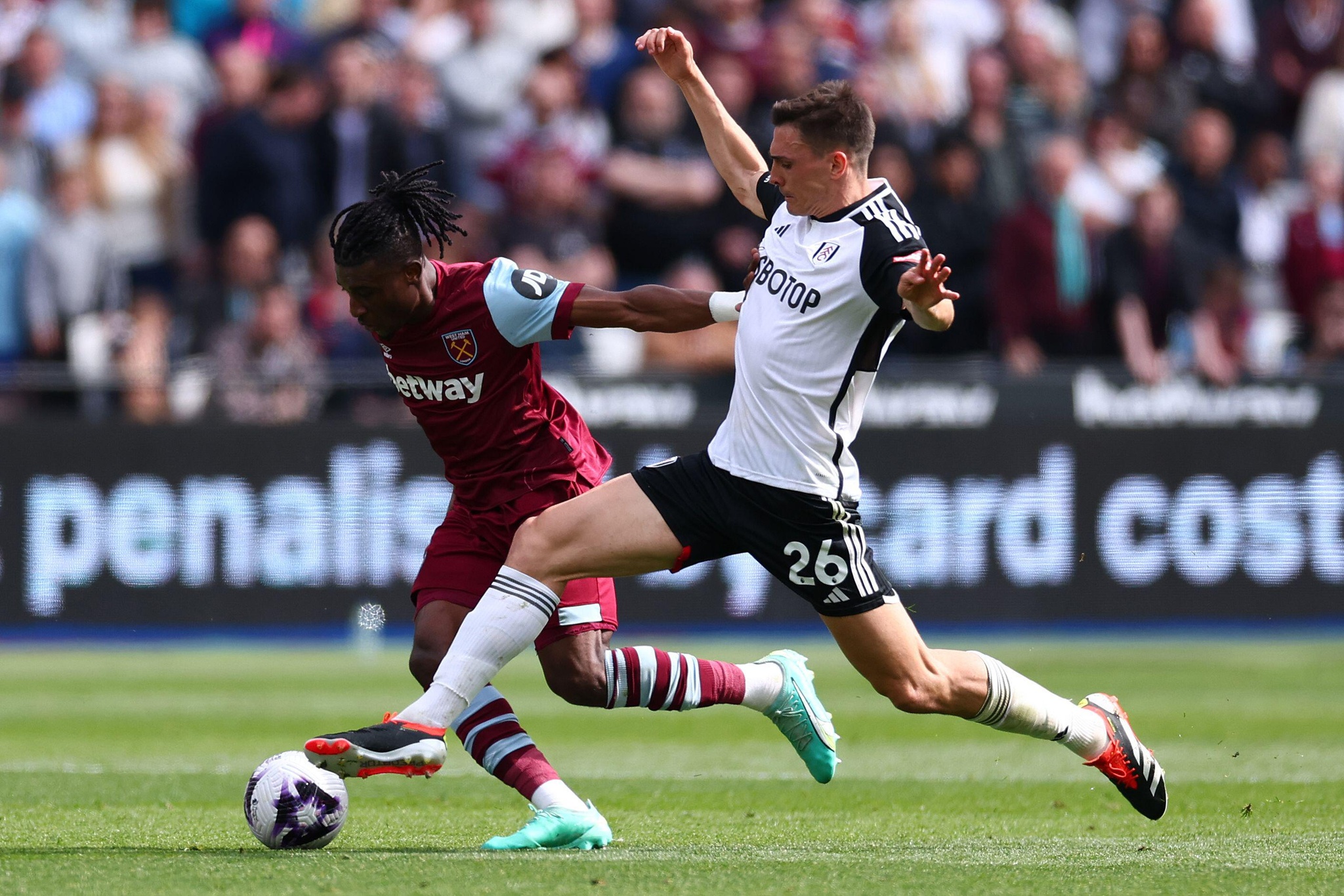 London Stadium, London, UK. 14th Apr, 2024. Premier League Football, West Ham United versus Fulham; Joao Palhinha of Fulham challenges Mohammed Kudus of West Ham United Credit: Action Plus Sports/Alamy Live News