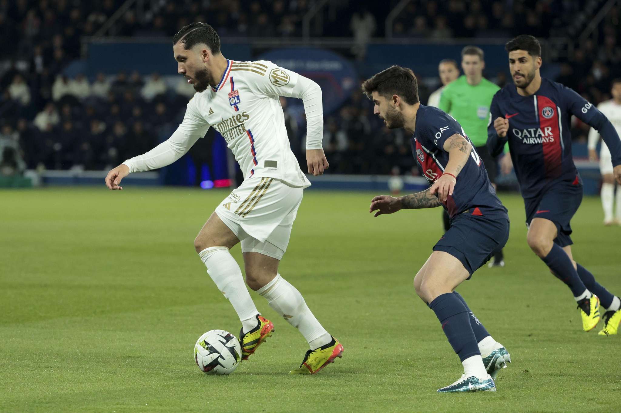 Rayan Cherki of Lyon, Lucas Beraldo of PSG during the French championship Ligue 1 football match between Paris Saint-Germain and Olympique Lyonnais (Lyon) on April 21, 2024 at Parc des Princes stadium in Paris, France