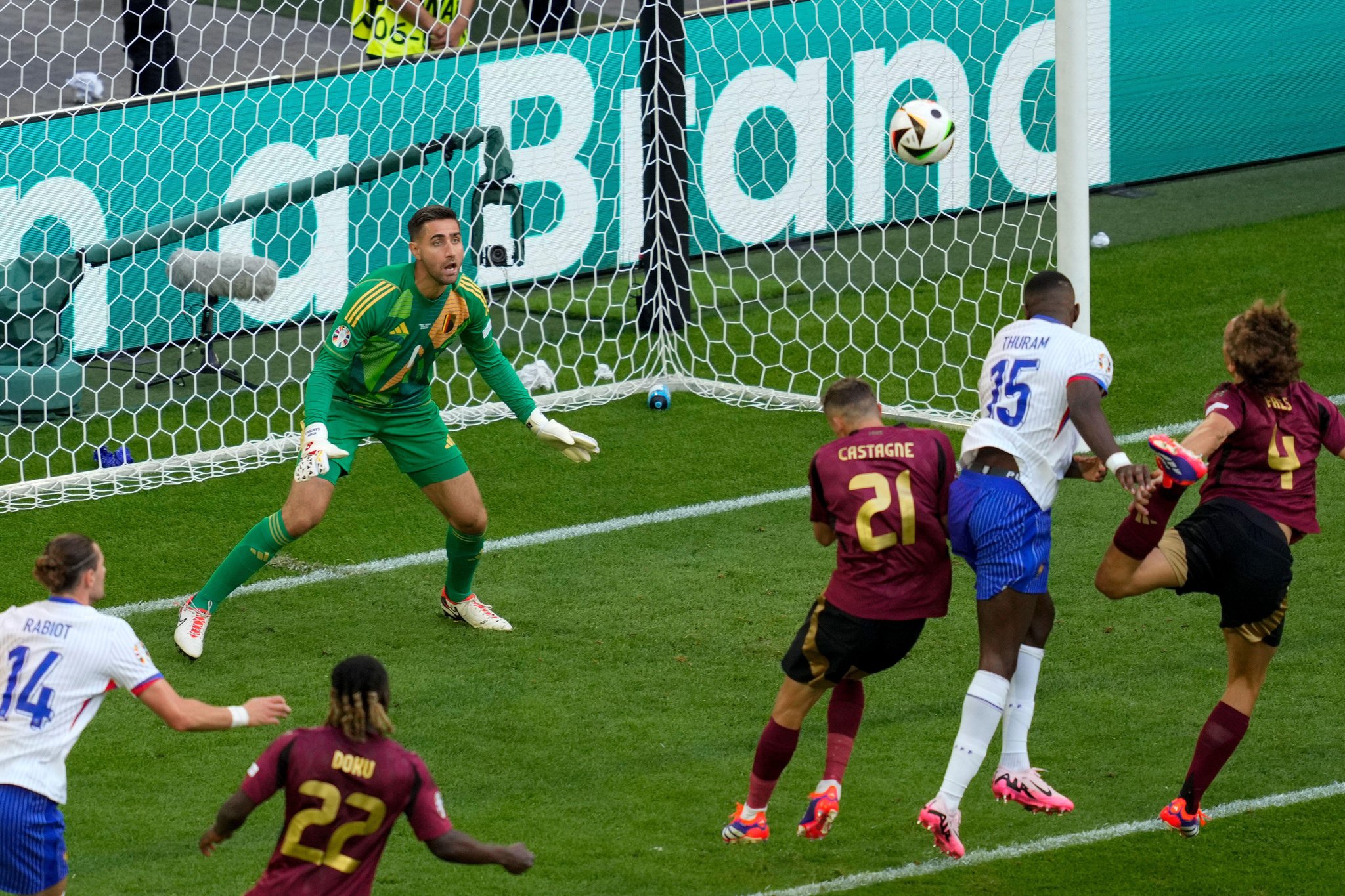 Belgium goalkeeper Koen Casteels eyes the ball during a round of sixteen match between France and Belgium at the Euro 2024 soccer tournament in Duesseldorf, Germany, Monday, July 1, 2024. (AP Photo/Andreea Alexandru)