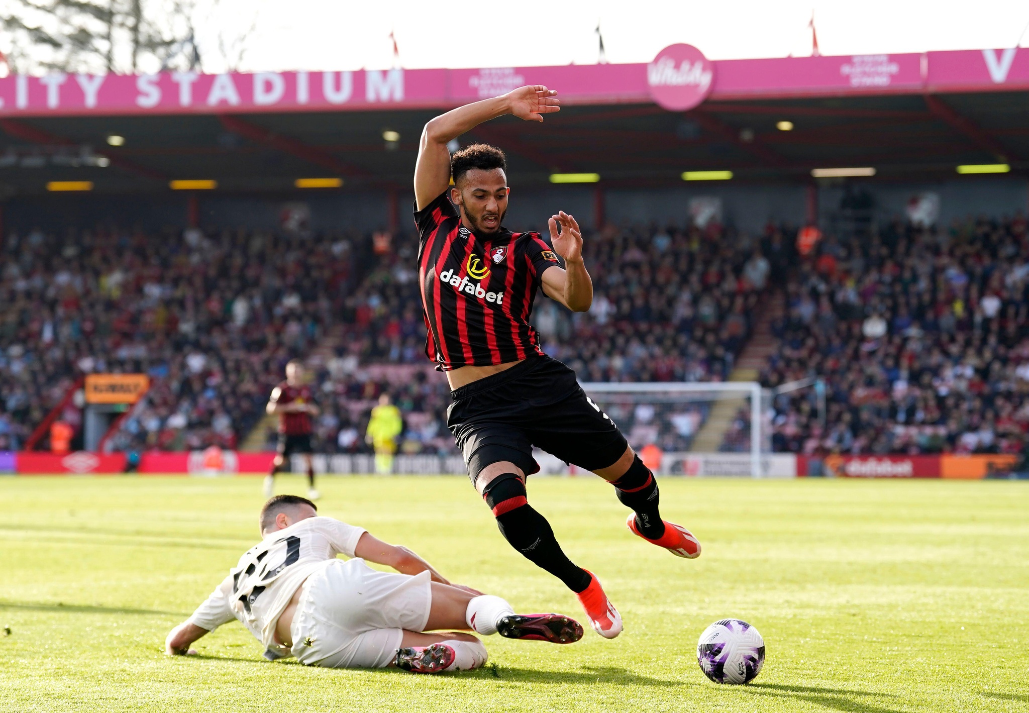 Manchester United's Diogo Dalot challenges Bournemouth's Lloyd Kelly during the Premier League match at the Vitality Stadium, Bournemouth. Picture date: Saturday April 13, 2024.
