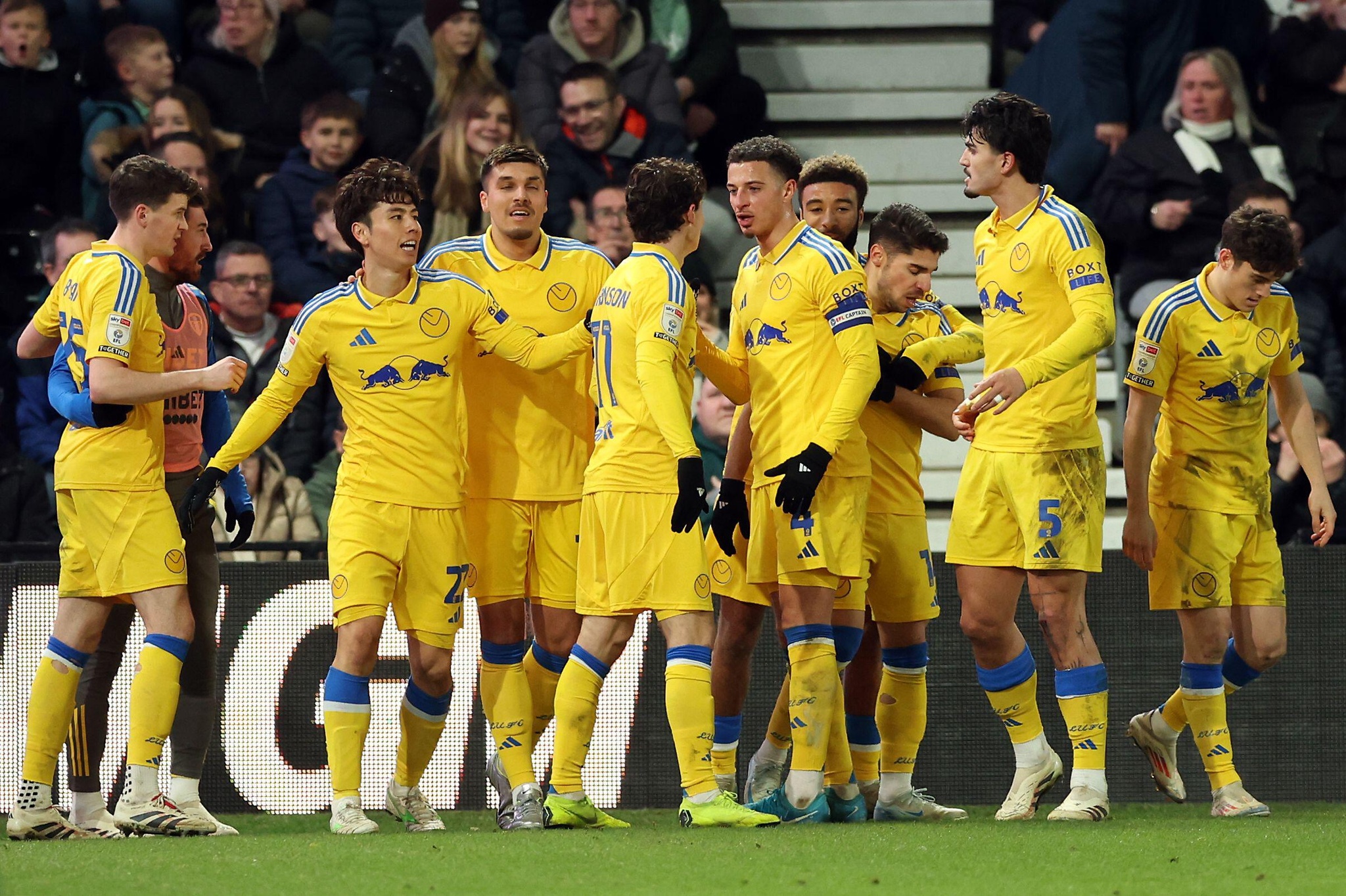 Leeds United's Brenden Aaronson (centre) celebrates scoring their side's first goal of the game with team-mates during the Sky Bet Championship match at Pride Park, Derby. Picture date: Sunday December 29, 2024.