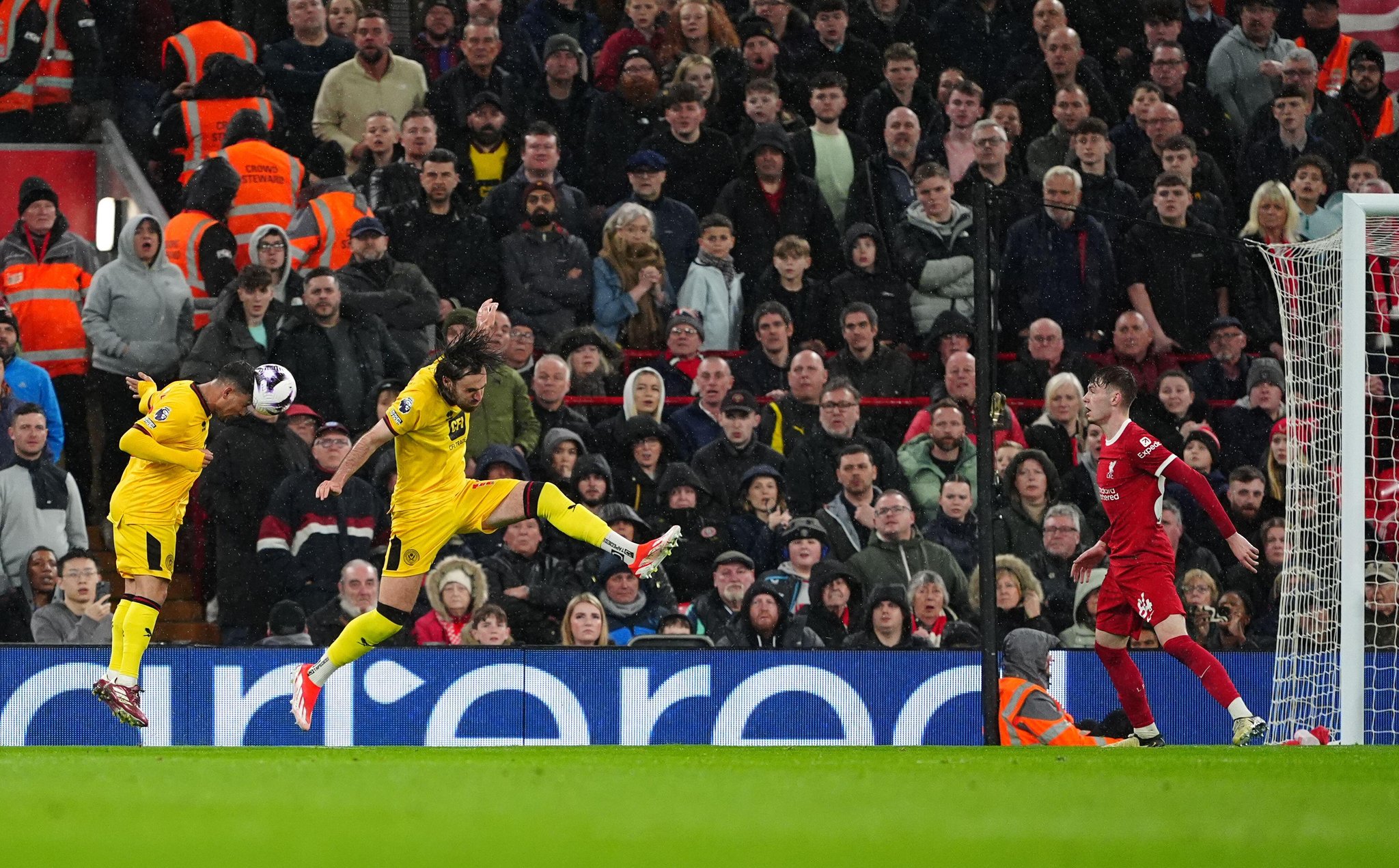 Liverpool's Conor Bradley (right) scores an own goal from Sheffield United's Gustavo Hamer (left) during the Premier League match at Anfield, Liverpool. Picture date: Thursday April 4, 2024.