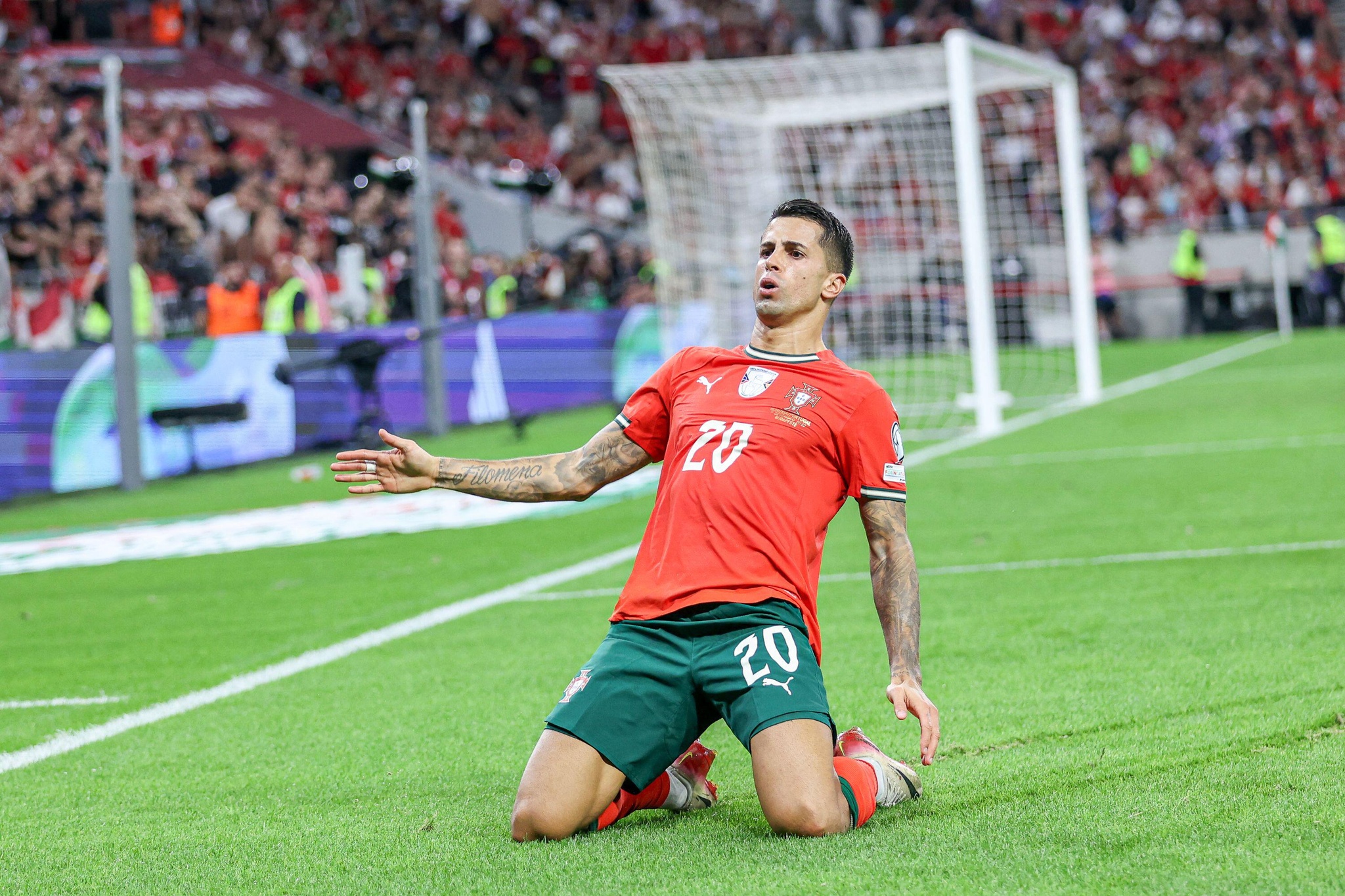 Joao Cancelo of Portugal celebrates after scoring a goal during European World Cup Qualifiers 2026 football match between Hungary and Portugal at Puskas Arena. Final score; Hungary 2 : 3 Portugal.