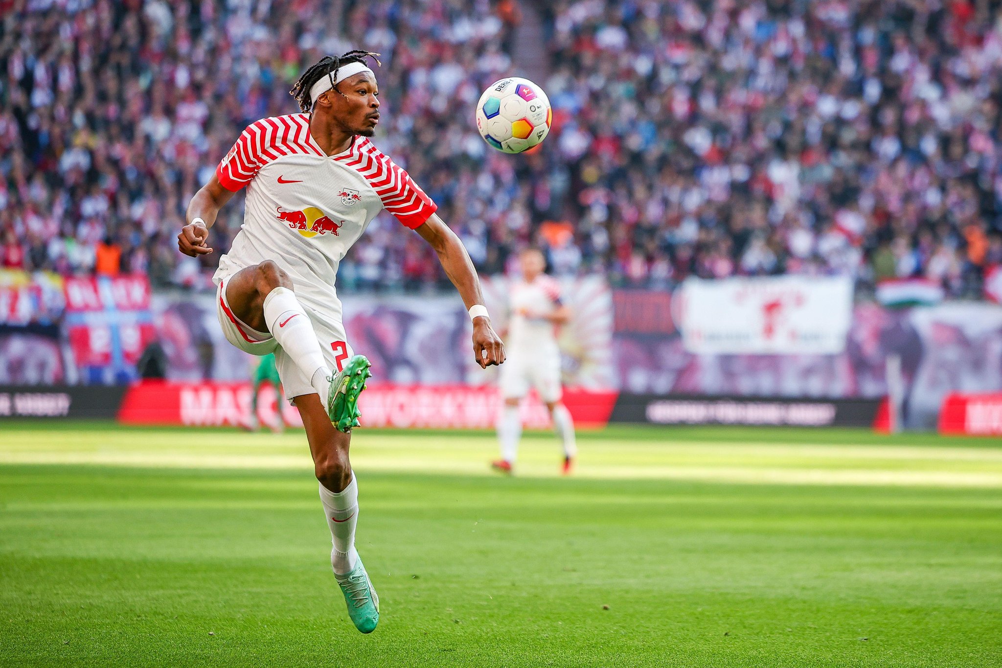 09 March 2024, Saxony, Leipzig: Soccer: Bundesliga, RB Leipzig - Darmstadt 98, Matchday 25 at the Red Bull Arena. Leipzig player Mohamed Simakan on the ball. Photo: Jan Woitas/dpa - IMPORTANT NOTE: In accordance with the regulations of the DFL German Football League and the DFB German Football Association, it is prohibited to utilize or have utilized photographs taken in the stadium and/or of the match in the form of sequential images and/or video-like photo series.