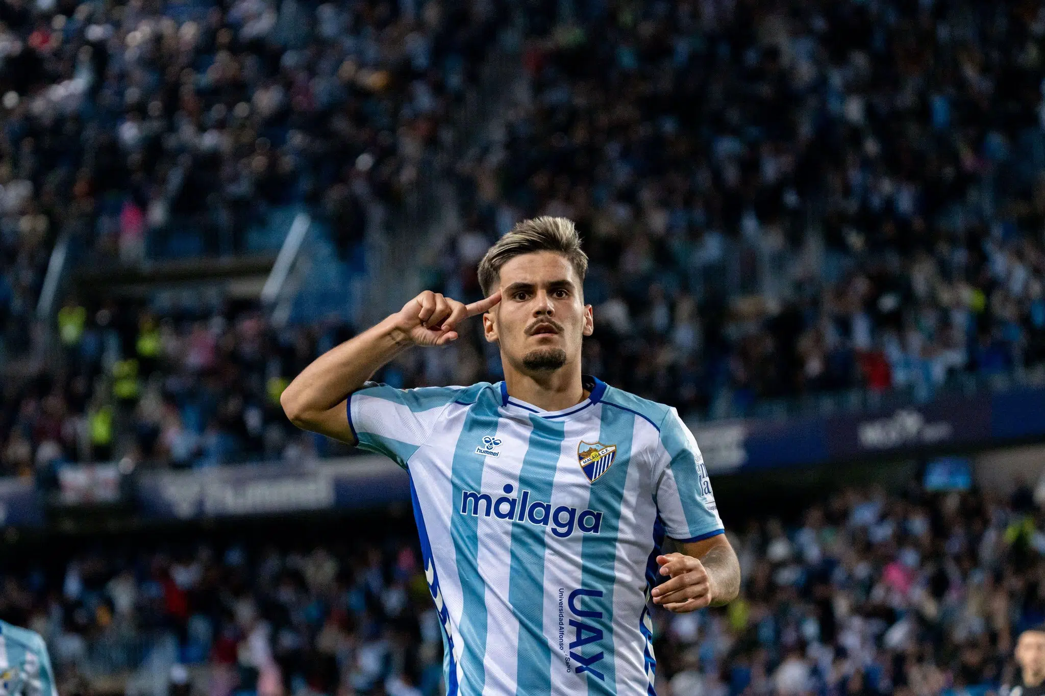 Malaga, Spain. 13th Mar, 2026. MALAGA, SPAIN - MARCH 15: Chupe (N9) celebrates after scoring Málaga's 4th goal during La Liga Hypermotion match between Malaga CF and SD Huesca at Estadio la Rosaleda on march 15, 2026 in Malaga, Spain Credit: SPP Sport Press Photo. /Alamy Live News